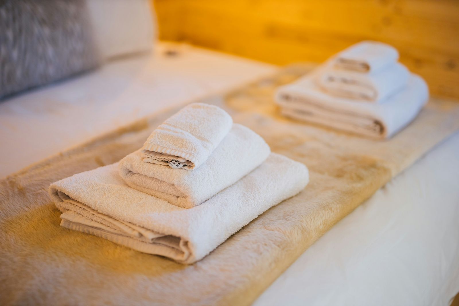 Towels folded on a bed